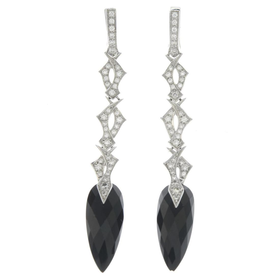 A pair of 18ct gold diamond and onyx 'Tattoo' earrings,: A pair of 18ct gold diamond and onyx 'Tattoo' earrings, by Stephen Webster.Total diamond weight 1.89cts, estimated G-H colour, VS clarity.Hallmarks for London, 2006. Length 6.3cms. 8.2gms.