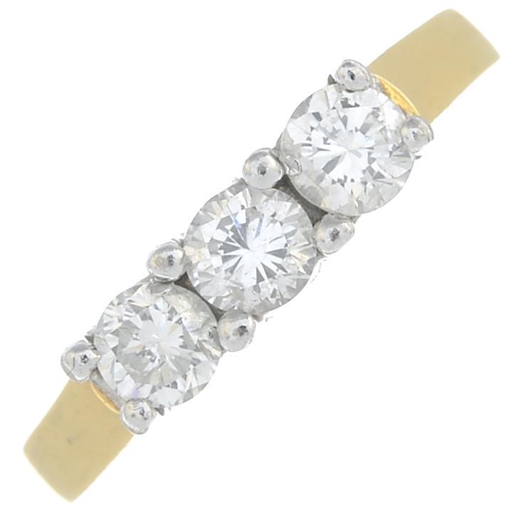 A brilliant-cut diamond three-stone ring.Estimated (1 of 3)
