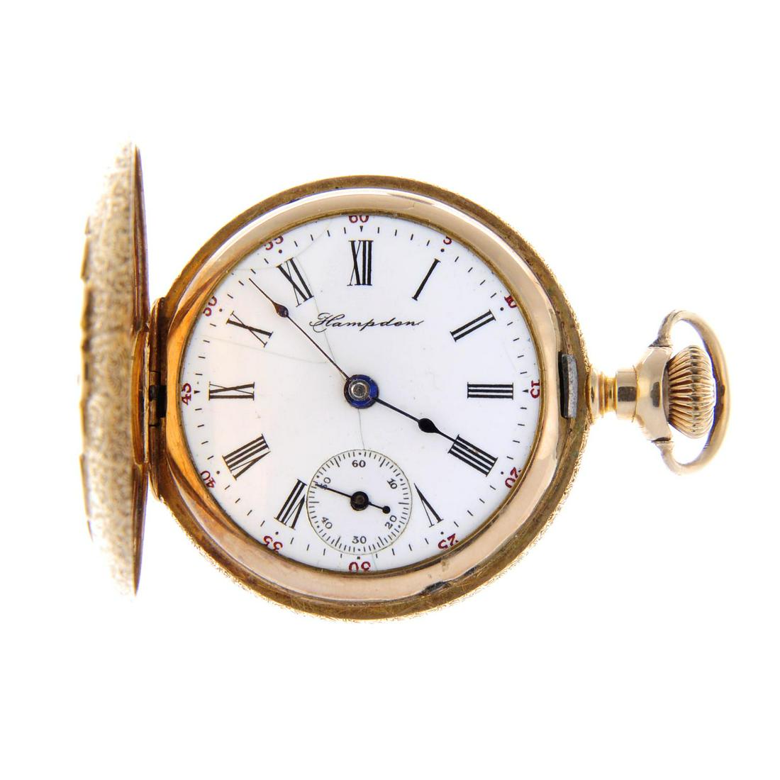 A full hunter fob watch by Hampden. Yellow metal case: A full hunter fob watch by Hampden. Yellow metal case with diamond set to case back, stamped 14K. Signed keyless wind movement with club tooth lever escapement. White dial. 32mm. 33gms.