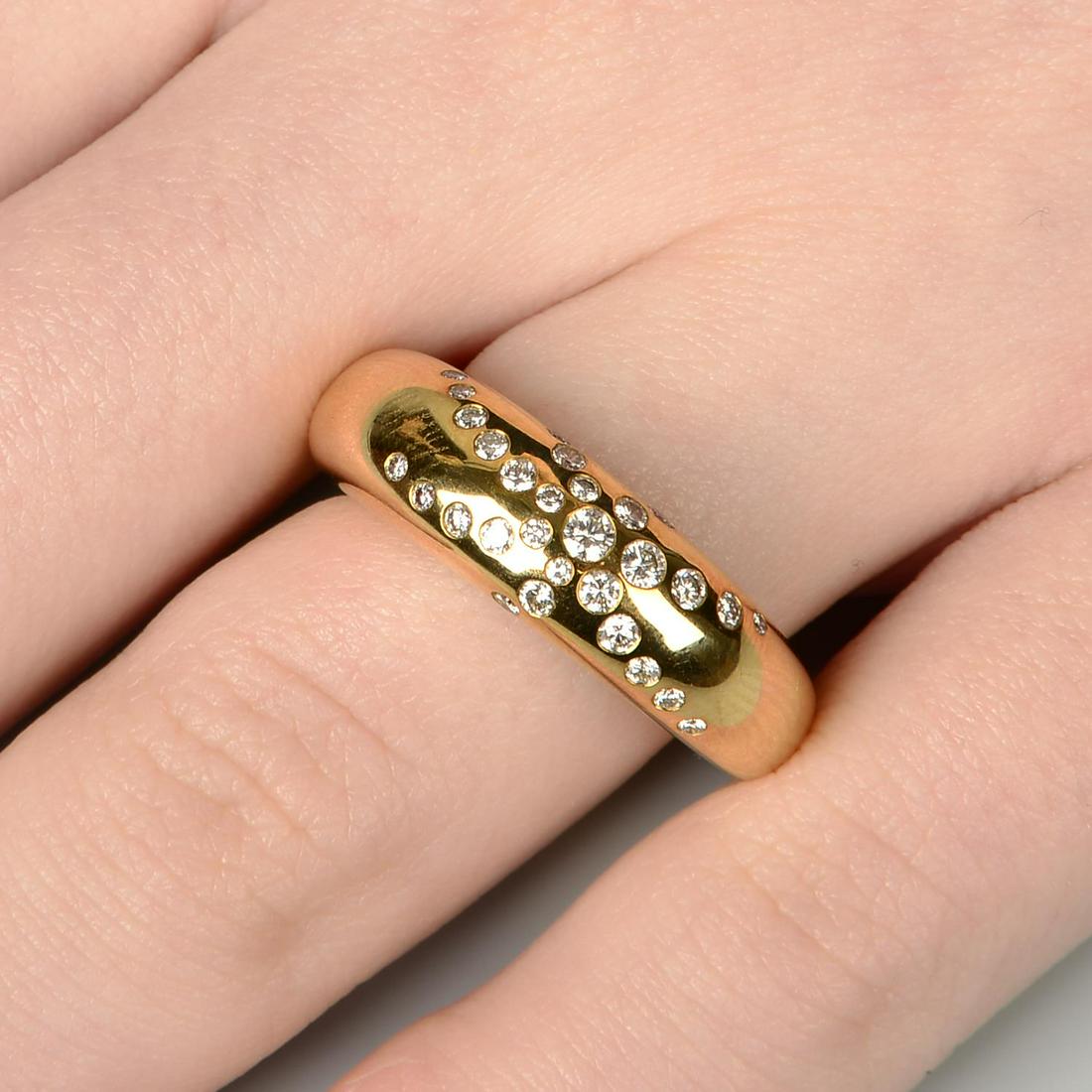 A diamond 'Anneau' ring, by Chaumet.Estimated total: A diamond 'Anneau' ring, by Chaumet.Estimated total diamond weight 0.40ct, G+ colour, VS clarity. French marks, stamped 750. Ring size M. 9.3gms.
