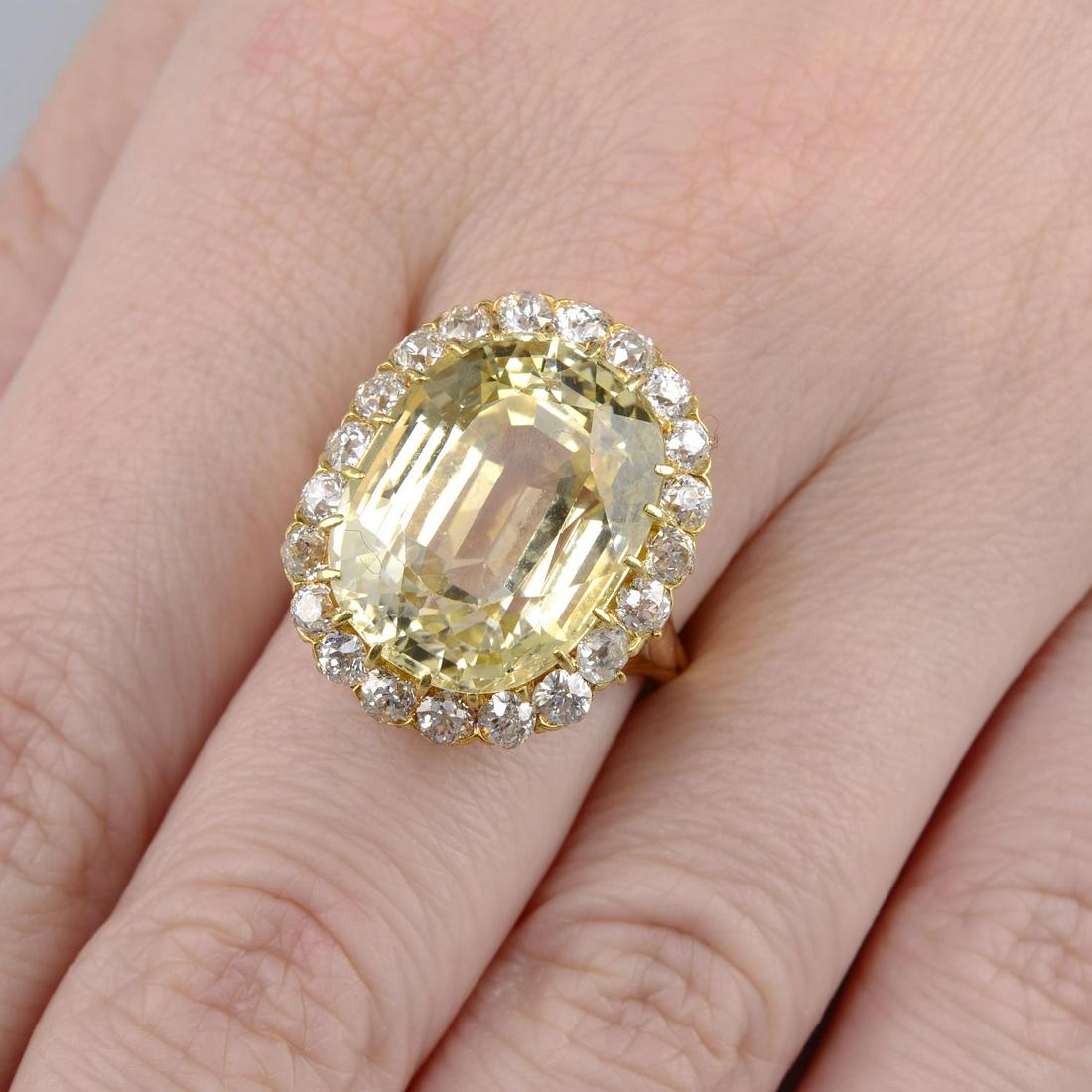 A yellow sapphire and old-cut diamond cluster ring. (1 of 5)