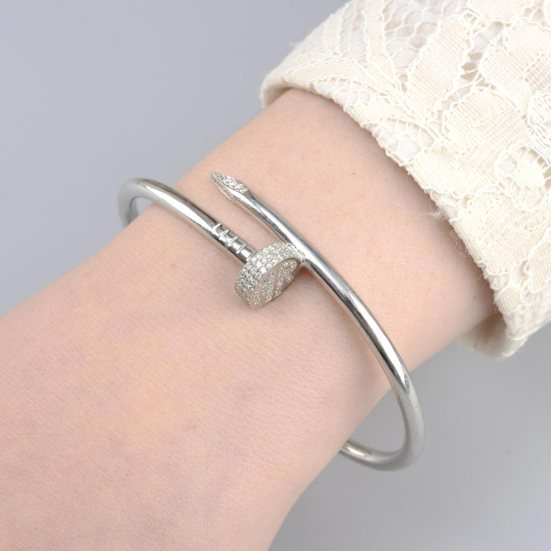 A pave-set diamond 'Juste un Clou' bangle, by Cartier. (1 of 4)