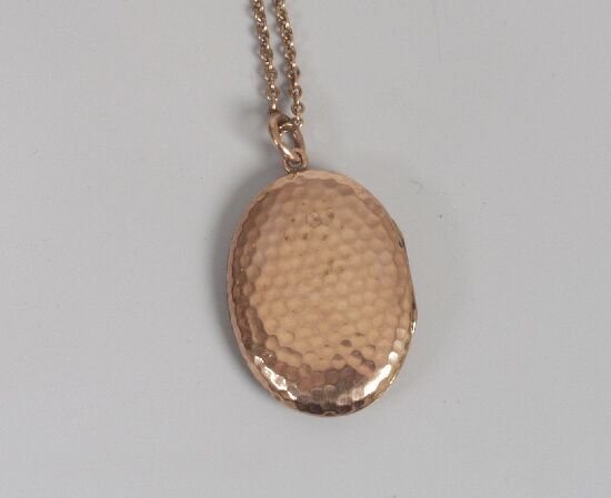 Edwardian 9ct gold locket, of oval form