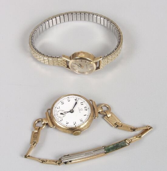 OMEGA - two lady's 9ct gold watches, on