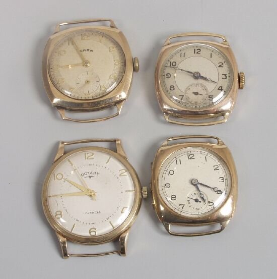 Four 9ct gold watch heads only, compris
