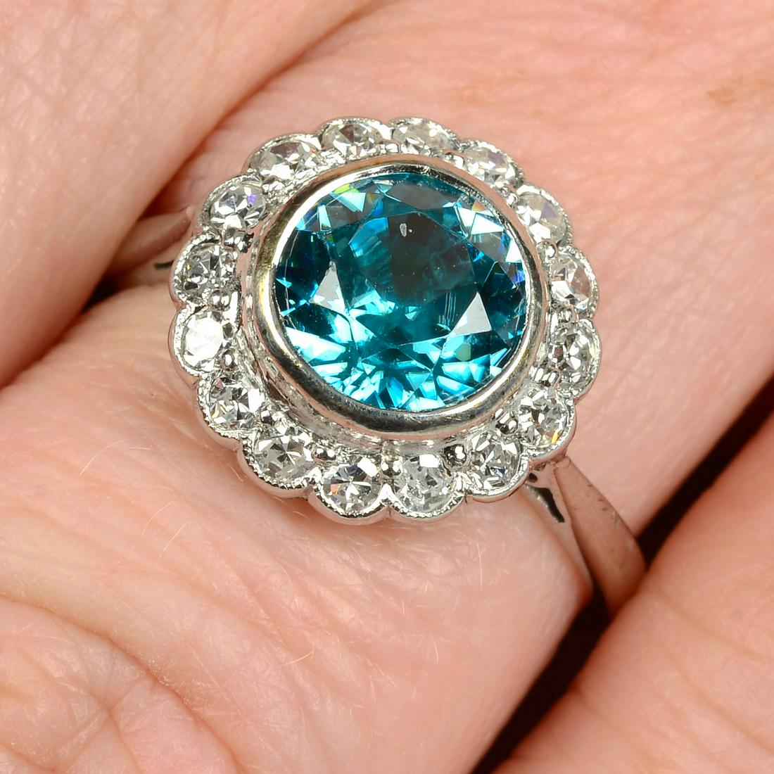 An early 20th century platinum and 9ct gold blue zircon and single-cut diamond cluster ring.Zircon (1 of 5)
