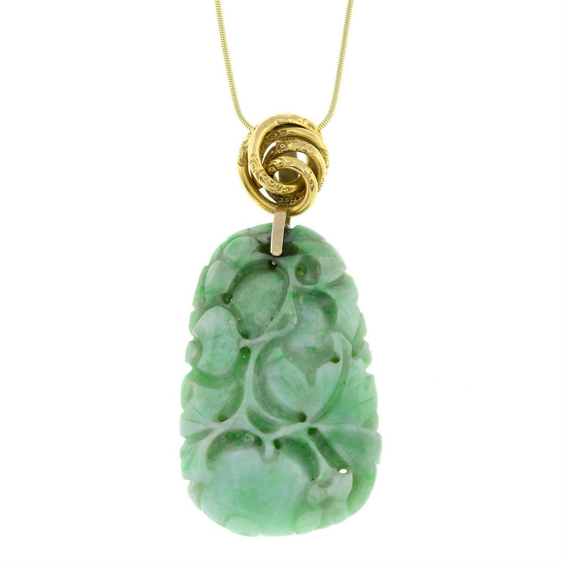 A jade pendant, carved to depict a fruit tree, on chain.: A jade pendant, carved to depict a fruit tree, on chain. Chain stamped 585. Length of pendant 6.3cms. Length of chain 39cms. 22.3gms.</