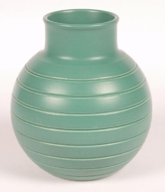 A Wedgwood Keith Murray matt green glazed: A Wedgwood Keith Murray matt green glazed vase, of globular outline and with short neck, incised with horizontal banding, printed marks and impressed letters "E X", height 6" (15cm).