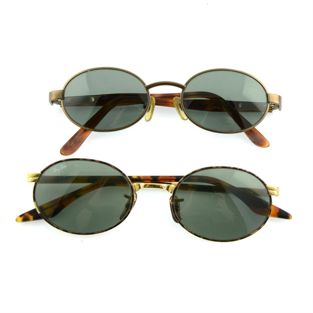 RAY-BAN - two pairs of sunglasses.: RAY BAN - two pairs of sunglasses. With one maker's case. Condition Report: Sunglasses are in good condition. However, there are some scratches to frames and lenses. With one maker's case. Cond