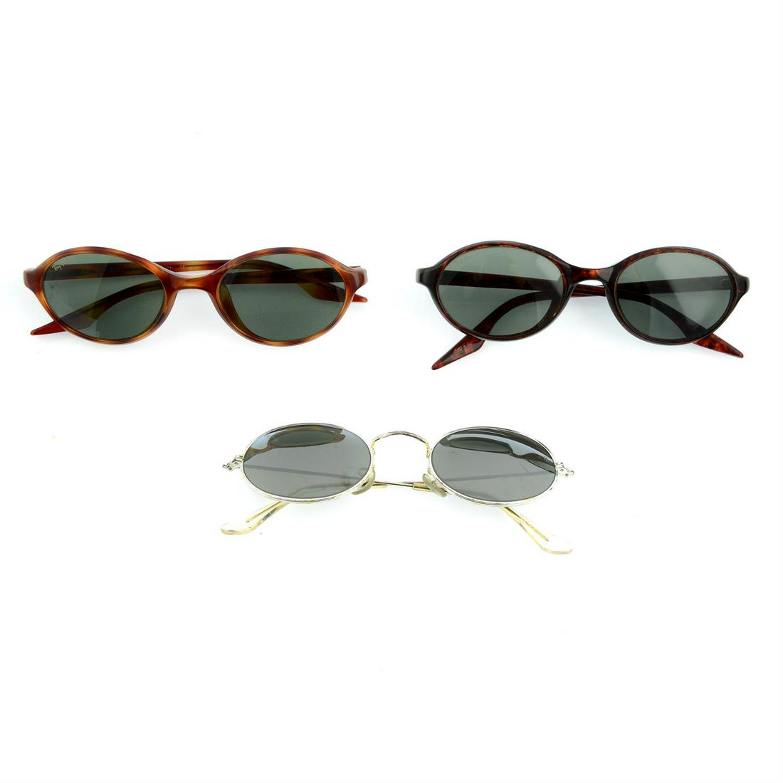 RAY-BAN - three pairs of sunglasses.: RAY BAN - three pairs of sunglasses. With one maker's case. Condition Report: Sunglasses are in good condition. However, there are scratches to frames and lenses. With one maker's case. Conditi