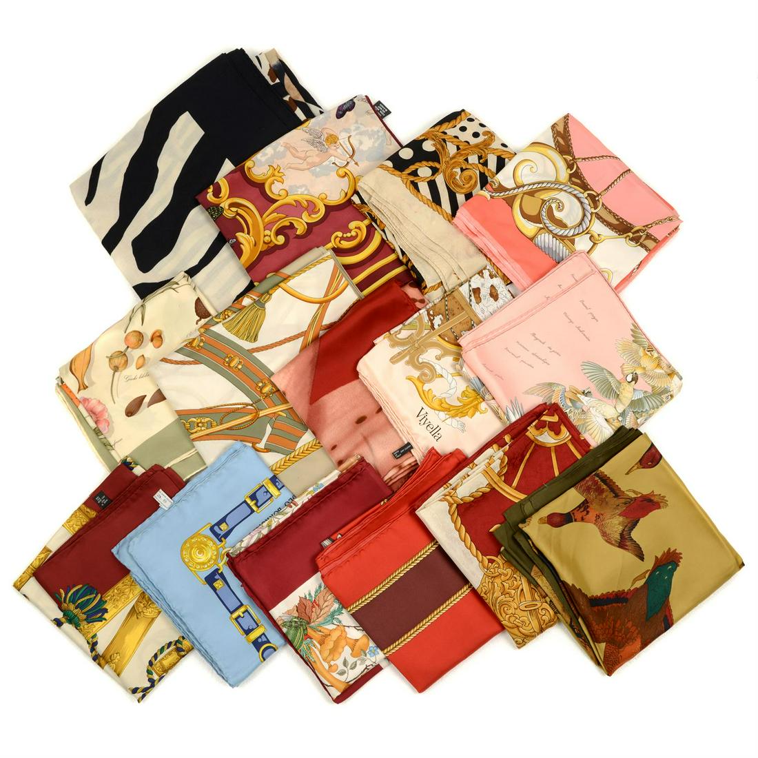 A selection of twenty-one scarfs (19 silk).: A selection of twenty-one scarfs (19 silk). To include examples by Escada, Cerruti and Harrods in variable sizes. Condition Report: Sold as seen. However, the scarves are in varying conditions with sc