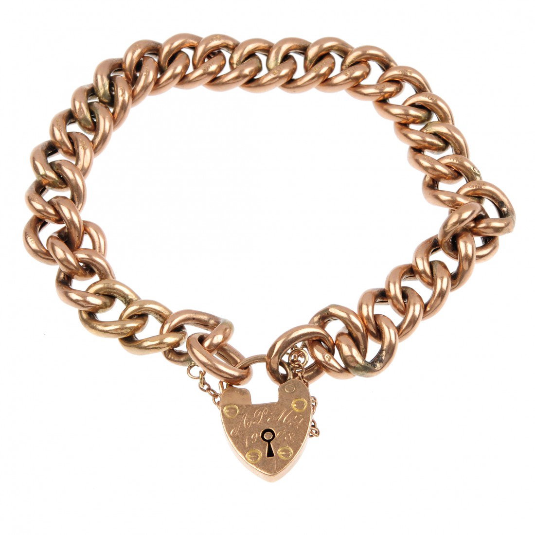 An Edwardian 9ct gold curb-link bracelet. The hollo: An Edwardian 9ct gold curb-link bracelet. The hollow curb-links to the padlock clasp. Padlock with hallmarks for Birmingham, 1908. Links stamped 9c. Length 19cms. Weight 18.40gms The bracelet is in ov