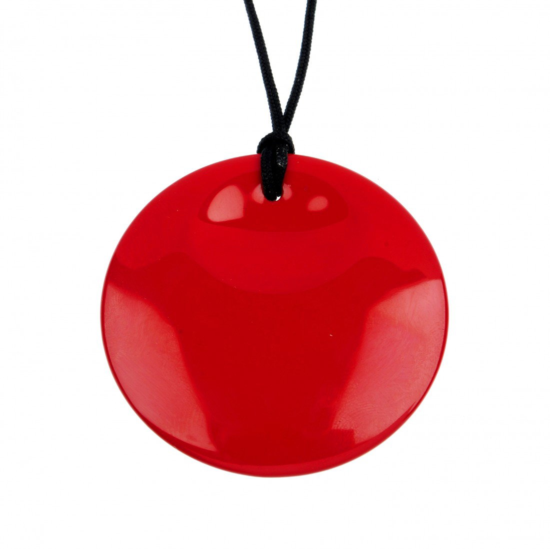 TIFFANY & CO - a circular red lacquer pendant by E: TIFFANY & CO - a circular red lacquer pendant by Elsa Peretti for Tiffany. The shaped red lacquer disc on a black silk cord. Signed Tiffany & Co. Japan with Elsa Peretti signature in gold. Diameter 4.