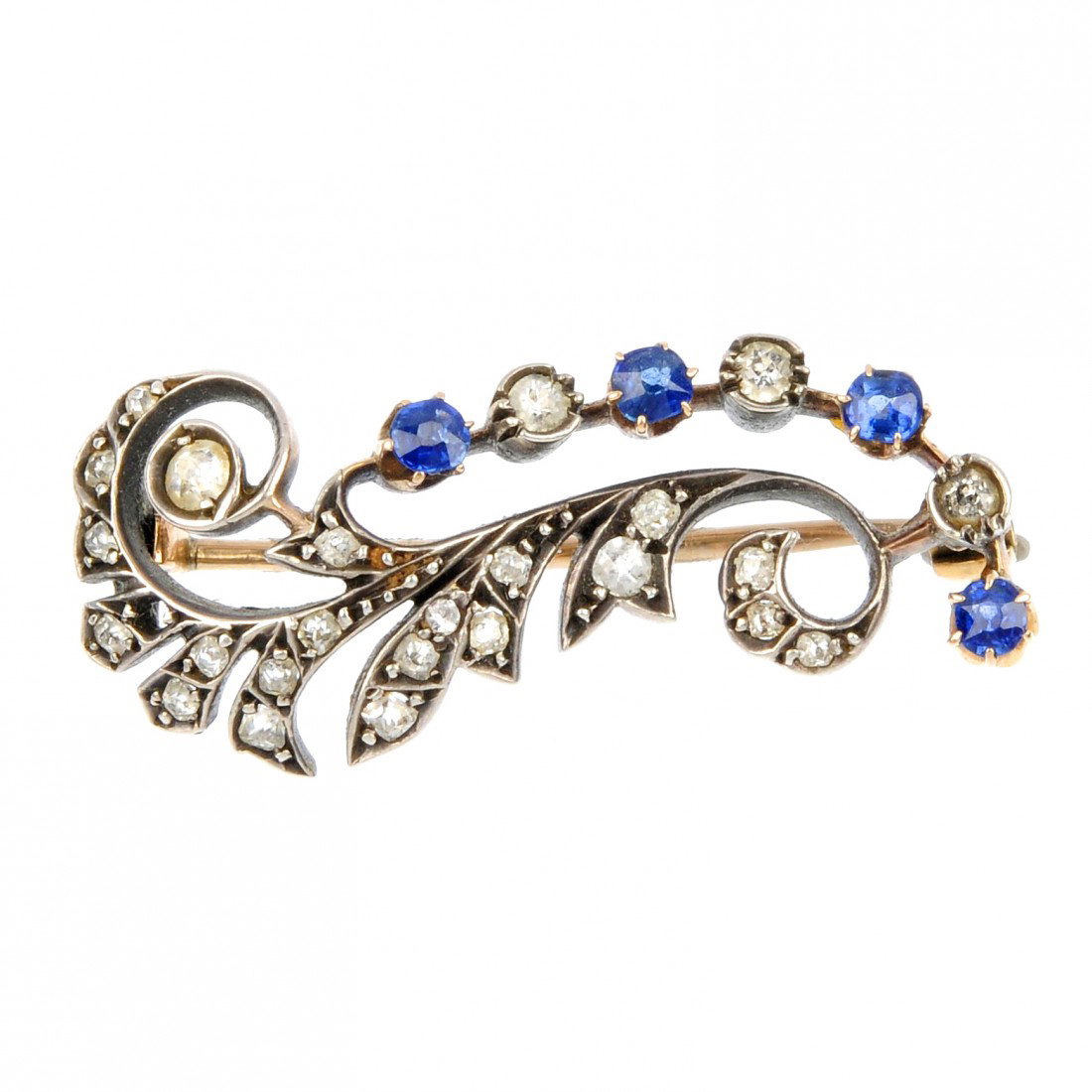 A late 19th century sapphire and diamond brooch. O: A late 19th century sapphire and diamond brooch. Of foliate design, the circular-shape sapphire and old European-cut diamond curved line to the the similarly-cut diamond scrolling surmount. Estimated 