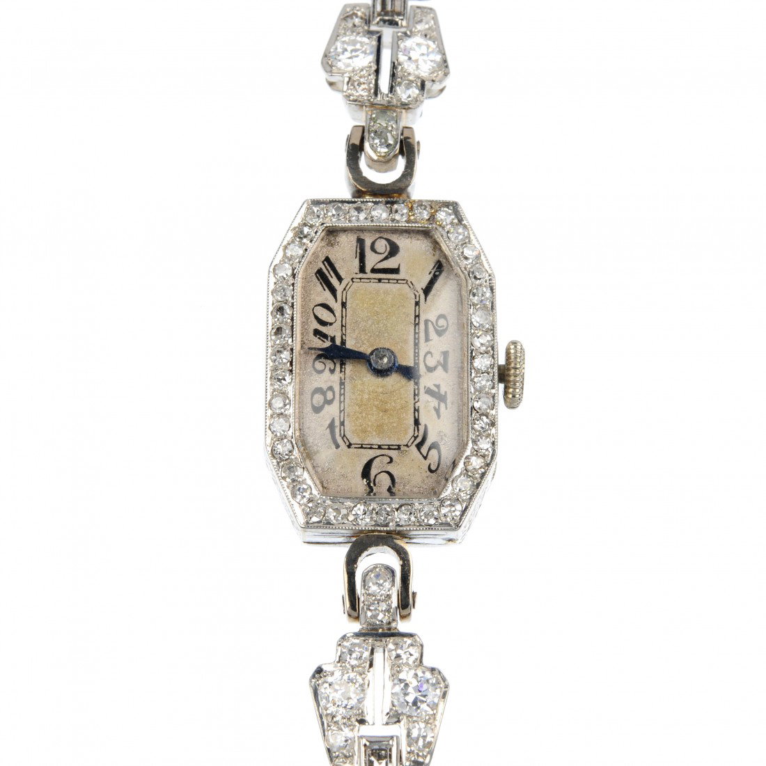 A diamond cocktail watch. The octagonal watch face: A diamond cocktail watch. The octagonal watch face with Arabic numerals, blued steel hands and single-cut diamond surround to the old European and single-cut diamond graduated geometric strap. Estimat