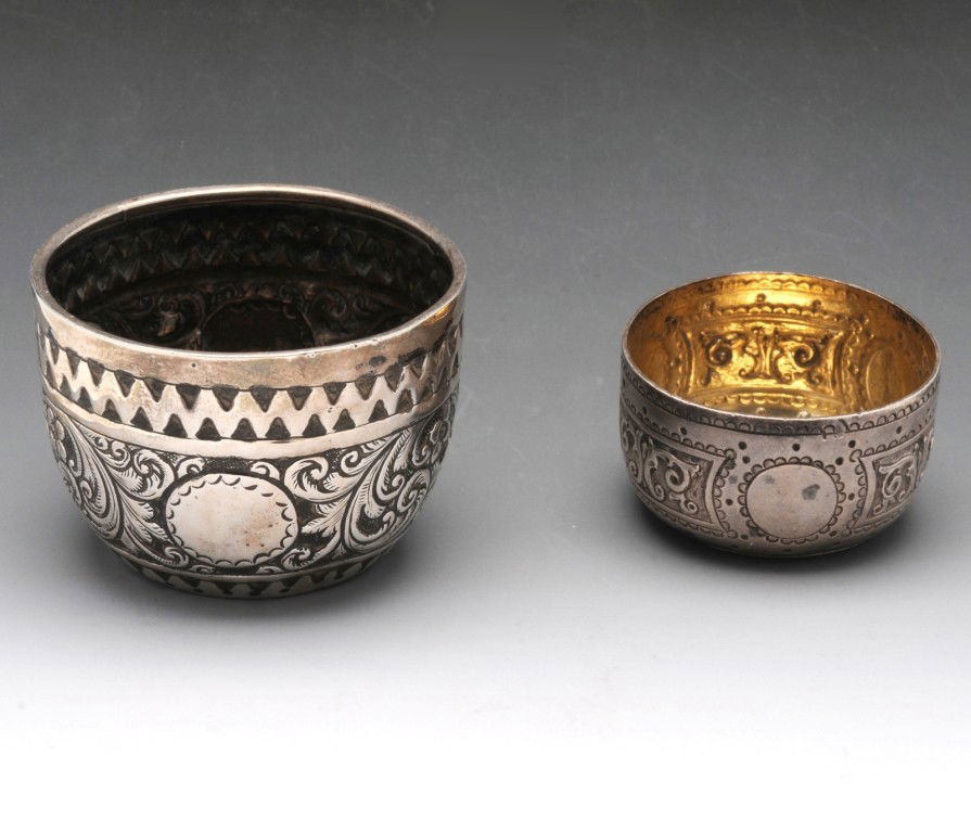 Victorian silver open salt of circular form.: Victorian silver open salt of circular form with flat chased foliate scrolls, hallmarked Charles Stuart Harris London 1884, diameter measuring 2 1/8 inches (5.5 cm). Together with a further small Vict