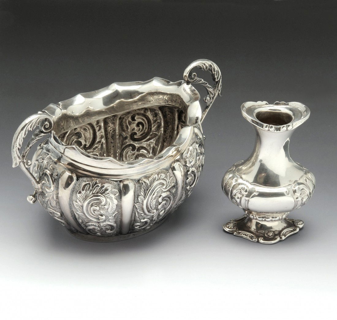 Edwardian silver twin handled sugar bowl.: Edwardian silver twin handled sugar bowl of oval form with embossed sectioned body, hallmarked Henry Matthews Birmingham 1902. Together with an Edwardian silver pepper, missing lid, hallmarked Birming