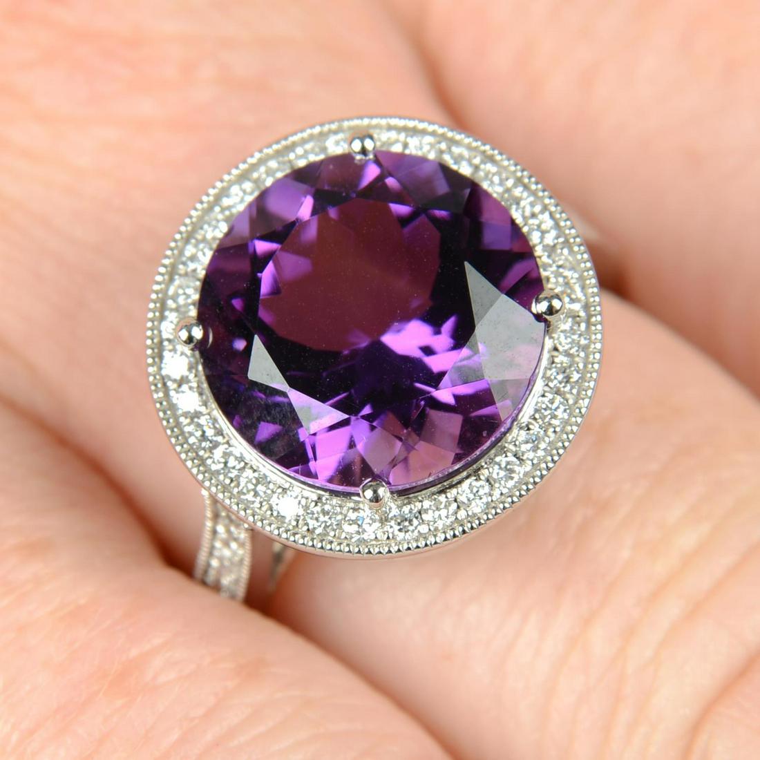 An 18ct gold amethyst and brilliant-cut diamond dress ring.Amethyst weight 5.31cts. Total diamond (1 of 5)