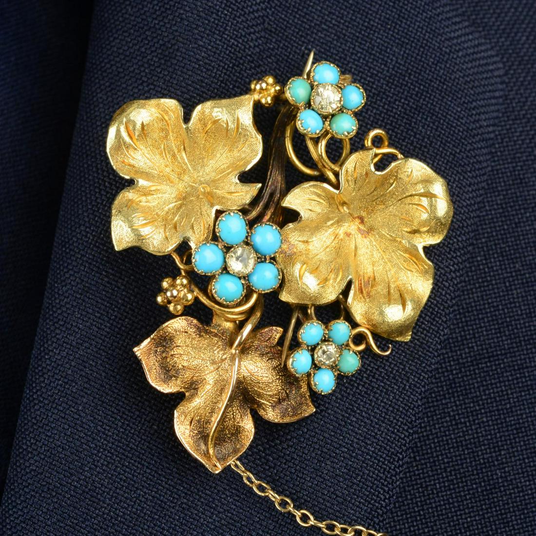 A mid 19th century 18ct gold chrysoberyl and turquoise floral brooch.Length 4.3cms. 8.5gms.We offer (1 of 4)
