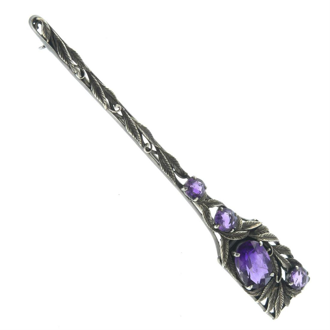 An Arts & Crafts silver amethyst brooch, by Bernard Instone.: An Arts & Crafts silver amethyst brooch, by Bernard Instone. Length 10.1cms. 9.8gms. Condition Report: General light marks, discolouration and wear. Amethysts are a deep purple hue, well saturated