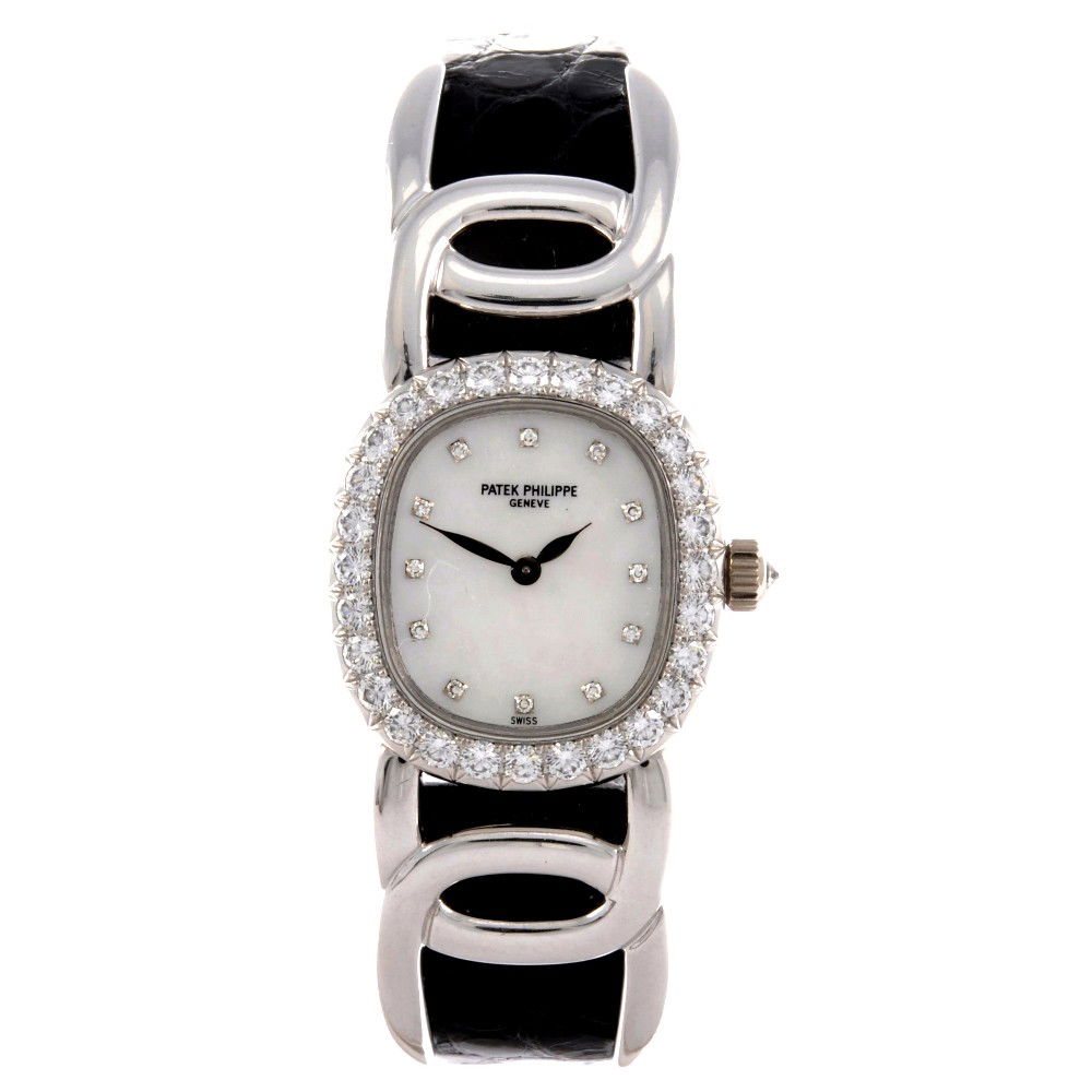 PATEK PHILIPPE - an 18ct white gold diamond set ma: PATEK PHILIPPE - an 18ct white gold diamond set manual wind lady's Golden Ellipse wrist watch, the mother of pearl dial having diamond dot hour markers, the ellipse shaped case, the bezel set with dia
