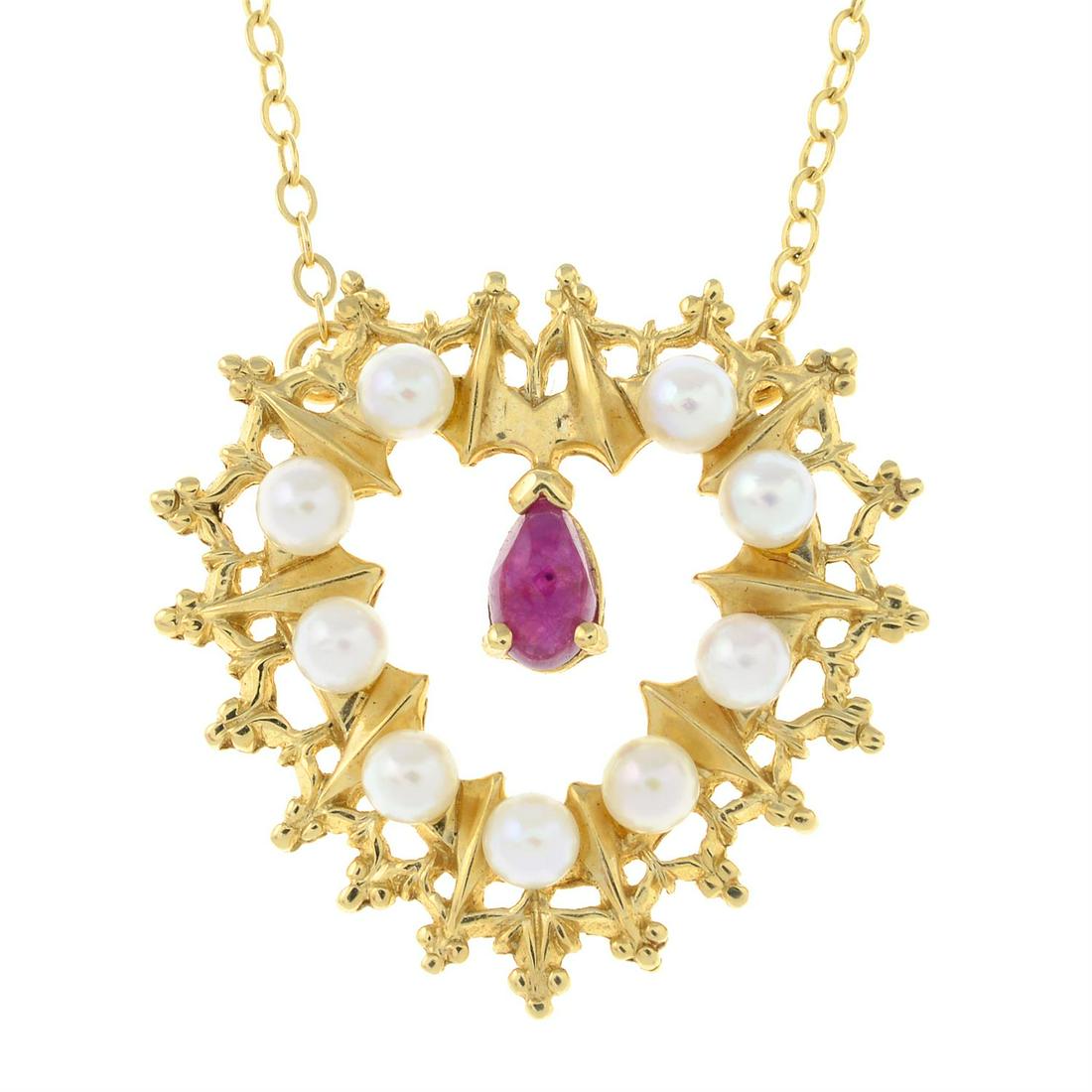 A ruby and cultured pearl heart pendant, on a 14ct gold integral chain.: A ruby and cultured pearl heart pendant, on a 14ct gold integral chain. Pendant stamped 14K. Chain with import marks for London. Length of pendant 2.1cms. Length of chain 39cms. Total weight 3.9gms. C