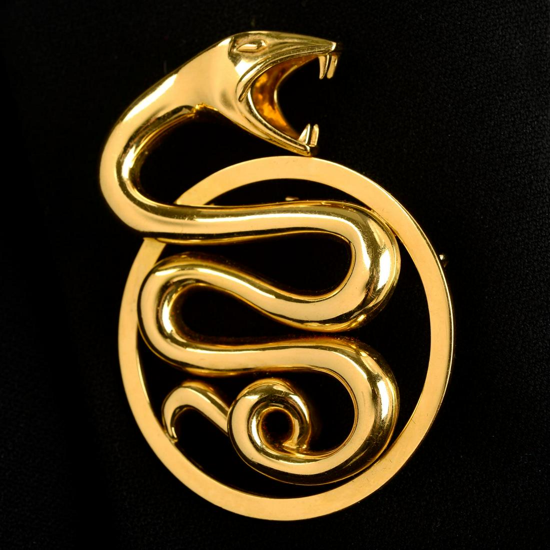A 'Trouble' snake brooch, by Boucheron. May be worn as a pendant.French assay marks. Length 6.1cms.: A 'Trouble' snake brooch, by Boucheron. May be worn as a pendant.French assay marks. Length 6.1cms. 50.4gms.