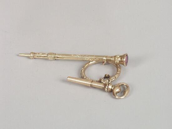 Victorian retractable pencil with pink: Victorian retractable pencil with pink foiled quartz set top (5.5cm long), a gold bolt ring and a watch key with ratchet mechanism.
