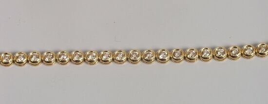 18ct yellow gold diamond collet set bra: 18ct yellow gold diamond collet set bracelet with box snap - diamond weight 1.00ct. ** Value Added Tax (17.5%) on the hammer price is imposed on this item unless for export (Subject to current UK VAT