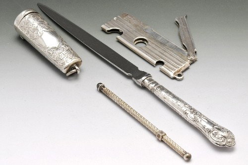 A 1920's silver mounted cigar tool.: A 1920's silver mounted cigar tool with engine turned decoration, hallmarked London 1921. Together with an early twentieth century cheroot case, hallmarked Birmingham 1911, Edwardian silver handled bu