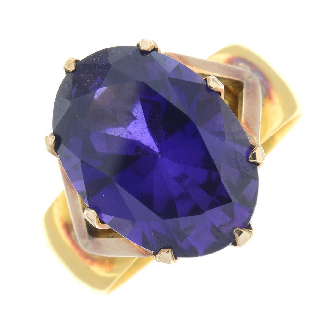 A synthetic colour-change sapphire single-stone ring, with 22ct gold band replacement.: A synthetic colour-change sapphire single-stone ring, with 22ct gold band replacement. Band with early 20th century hallmarks for Birmingham, 1911. Ring size N. Total weight 7.6gms. Condition Report: