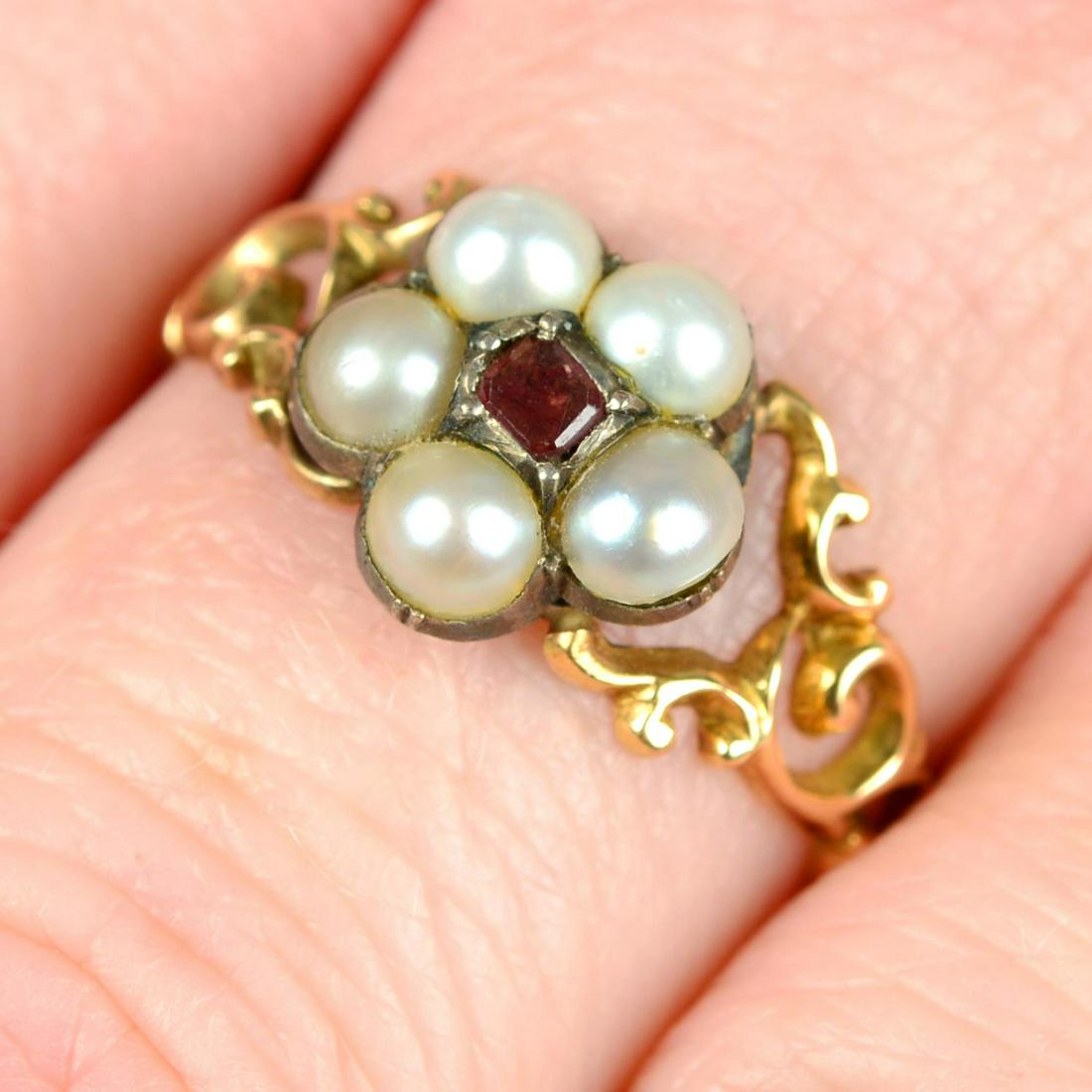 A 19th century 15ct gold garnet and split pearl floral cluster ring.Ring size O. 1.8gms. (1 of 5)