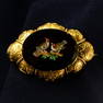 A late 19th century micro mosaic brooch, depicting goldfinches, with 18ct gold cannetille