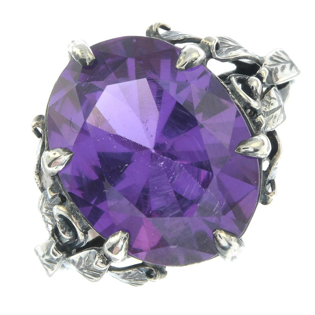 An Arts & Crafts silver synthetic sapphire ring, by Bernard Instone.: An Arts & Crafts silver synthetic sapphire ring, by Bernard Instone. Stamped silver. Ring size Q. 5.7gms. Condition Report: General light marks, discolouration