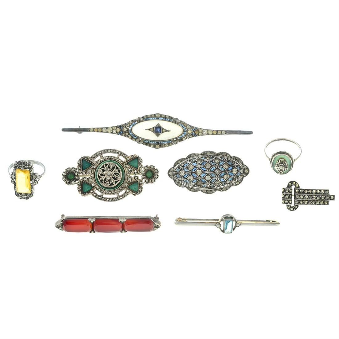 Eight Art Deco silver gem-set jewellery items.: Eight Art Deco silver gem-set jewellery items, to include six brooches and two rings. 52.7gms. Condition Report: