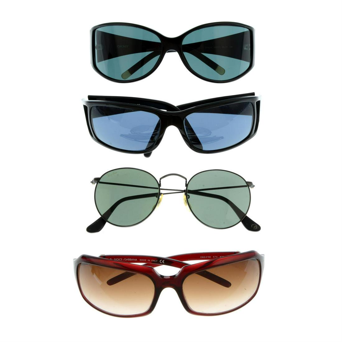Four pairs of designer sunglasses.: Four pairs of designer sunglasses. To include Dolce & Gabbana, DKNY, Prada and Ray Ban examples. With four maker's cases. Condition Report: Sunglasses are in overall good condition. However, there