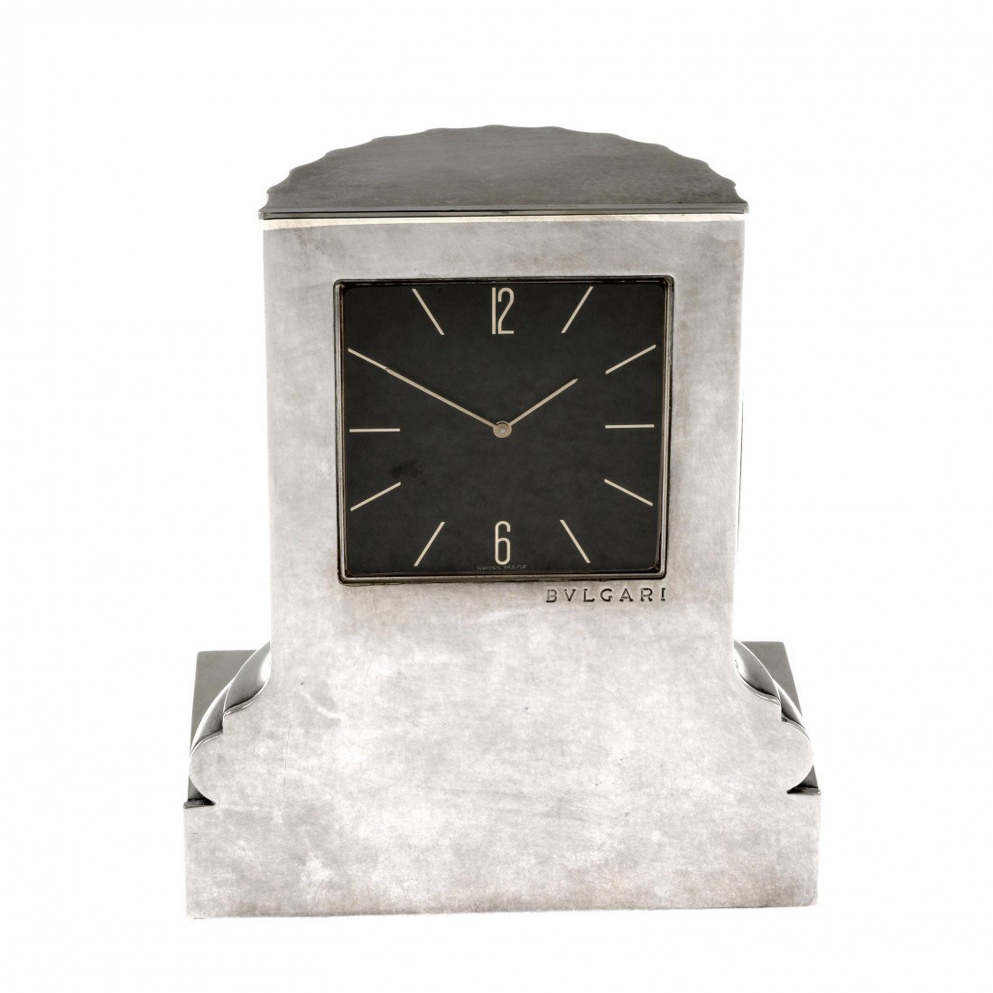 Miscellaneous: A silver Bulgari desk clock, modelled as a Corinthian column, the matt black dial with hourly applied batons and Arabic six and twelve. Case width 81mm. Total weight 401gms.