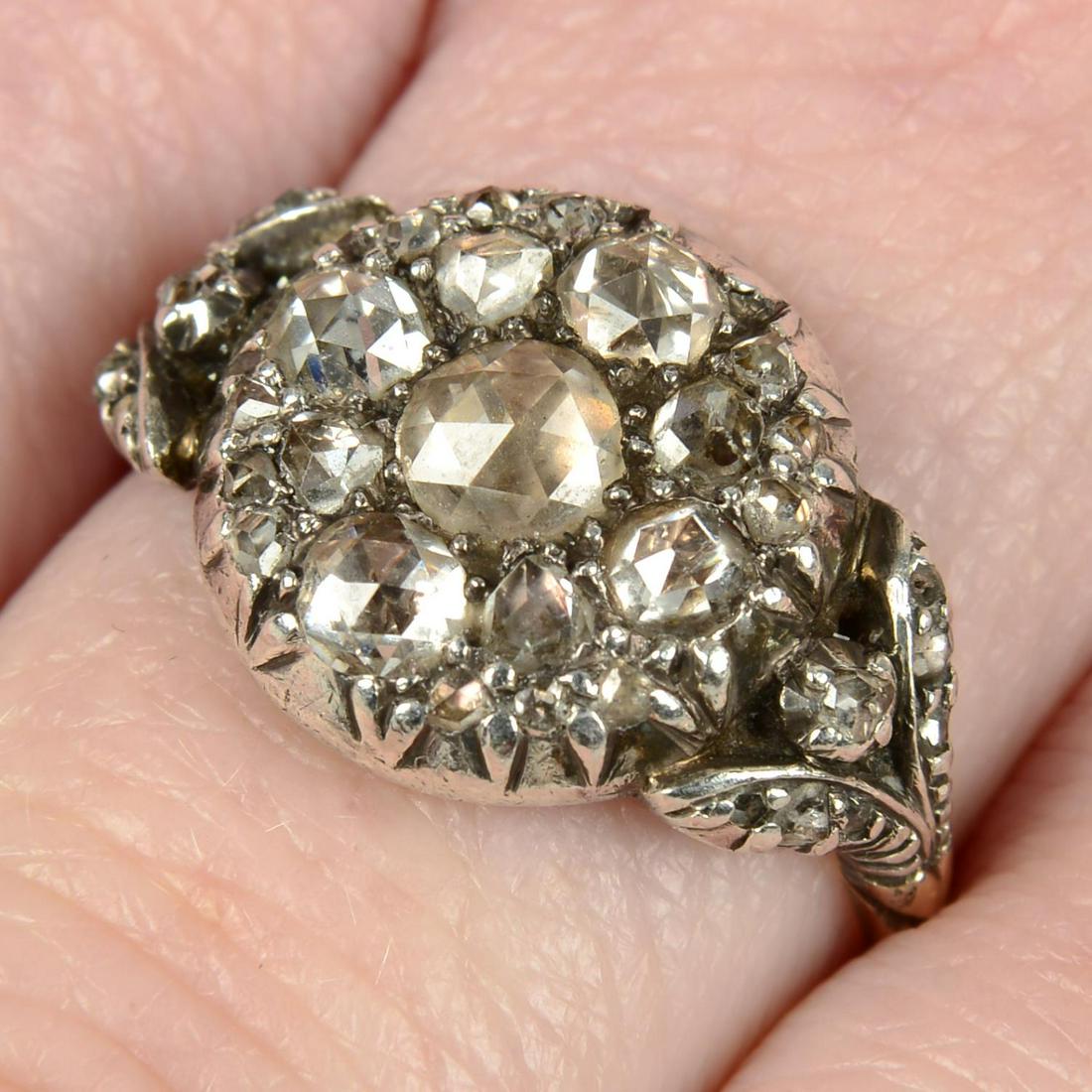 A rose-cut diamond cluster ring, with similarly-cut diamond foliate shoulders.Ring size N1/2. (1 of 5)