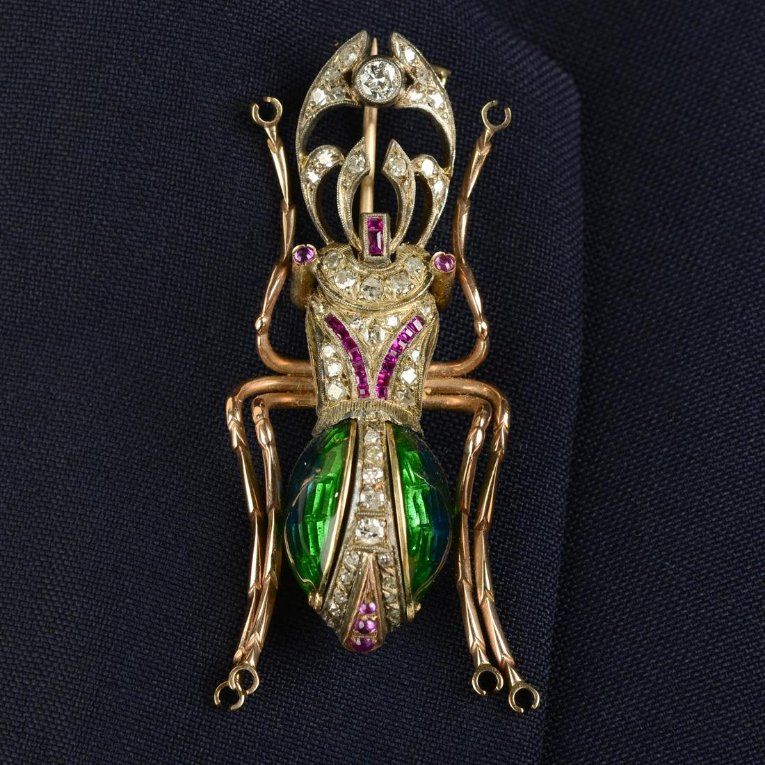 An early 20th century 'Egyptian Revival' gold and silver calibre-cut ruby, diamond and enamel (1 of 4)