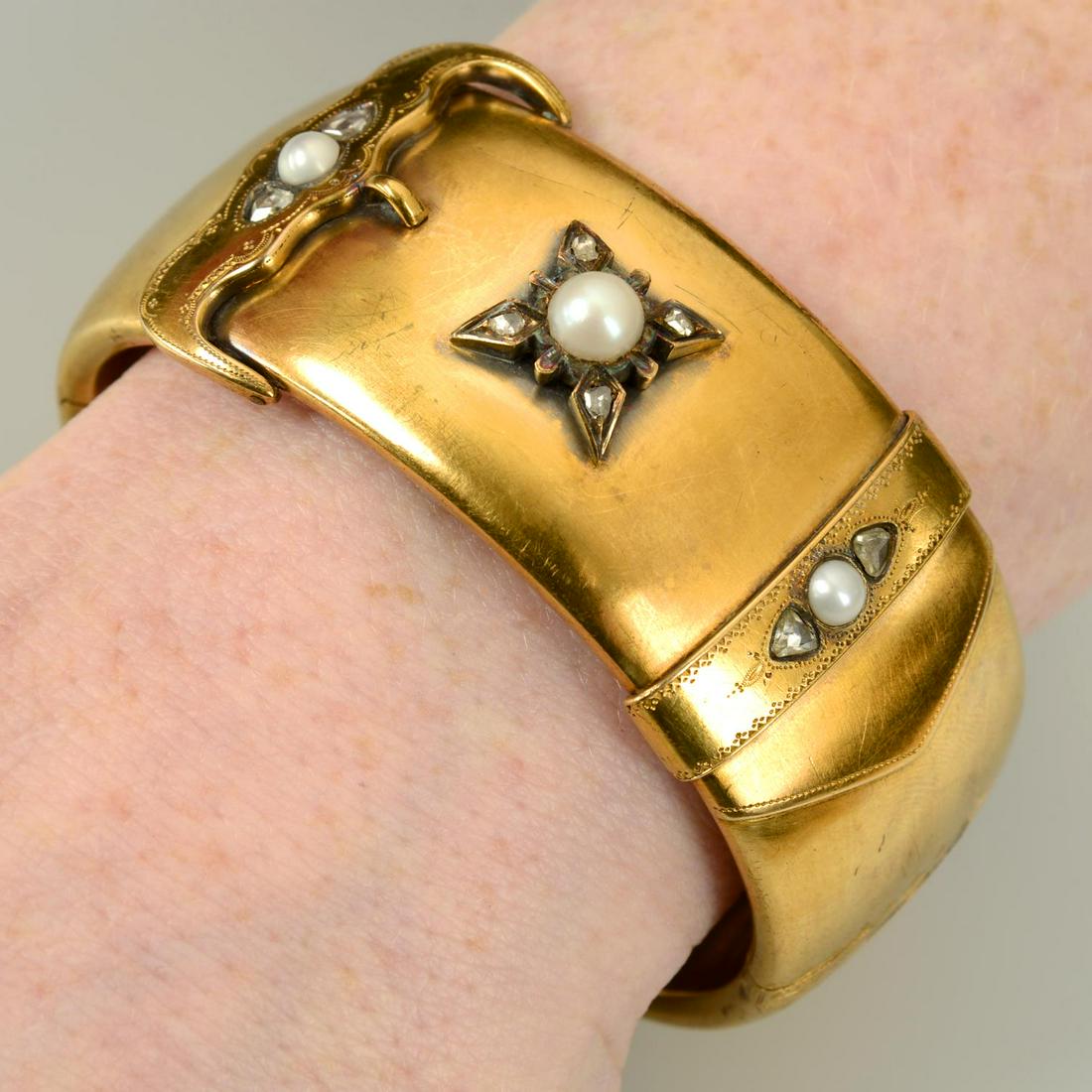 A late Victorian 18ct gold split pearl and rose-cut diamond accent buckle motif hinged bracelet, (1 of 3)
