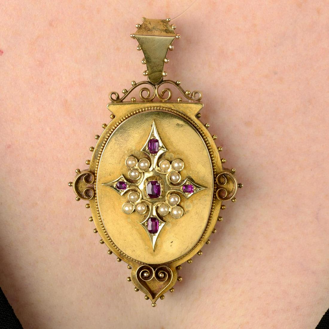 A late 19th century gold ruby and split pearl cross motif locket. Length 6.2cms. 14gms. (1 of 5)