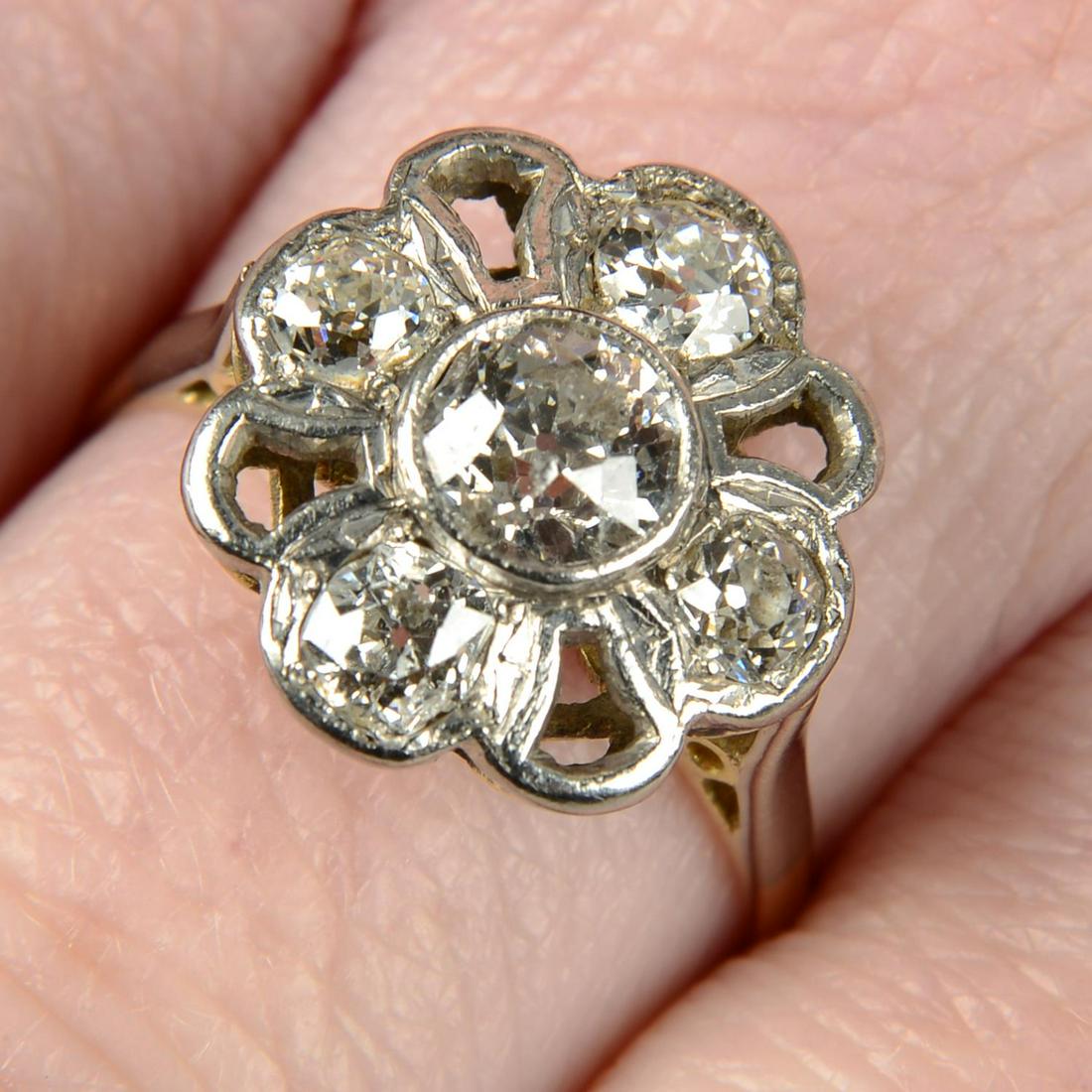 An early to mid 20th century platinum and 18ct gold old-cut diamond floral dress ring.Estimated (1 of 5)