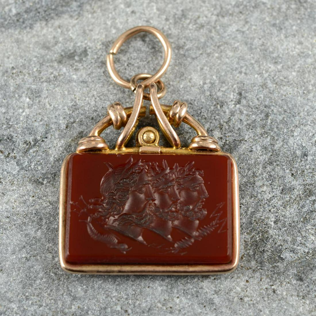 A 19th century gold carnelian intaglio pendant, carved to depict Zeus, Poseidon and Hades in (1 of 3)