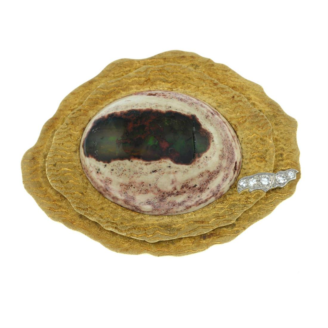 An 18ct gold boulder opal and single-cut diamond brooch, with textured, stepped surrounds, by Grima.: An 18ct gold boulder opal and single-cut diamond brooch, with textured, stepped surrounds, by G