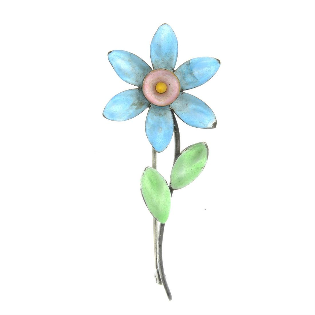 An Arts and Crafts silver enamel flower brooch, by Bernard Instone.: An Arts and Crafts silver enamel flower brooch, by Bernard Instone. With maker's mark. Stamped SILVER. Length 7cms. 8.4gms. Condition Report: Overall condition fair to good. Some surface scratches/ we