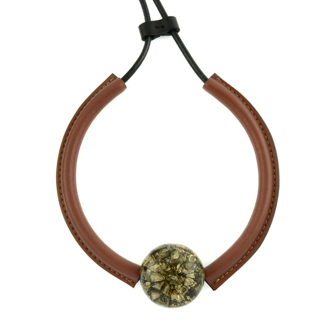 MARNI - a Pyrite in resin pendant, on a brown leather collar necklace.: MARNI - a Pyrite in resin pendant, on a brown leather collar necklace. With maker's dust cover and box. Condition Report: Necklace is in good condition. Pyrite is encased in resin. With maker's dust c