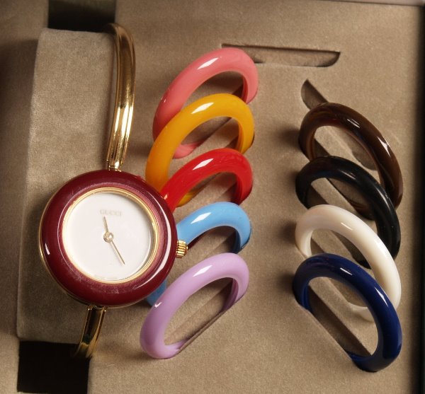 GUCCI - ladies gold plated inter changeable bezel: GUCCI - ladies gold plated inter changeable bezel watch together with box and booklet.