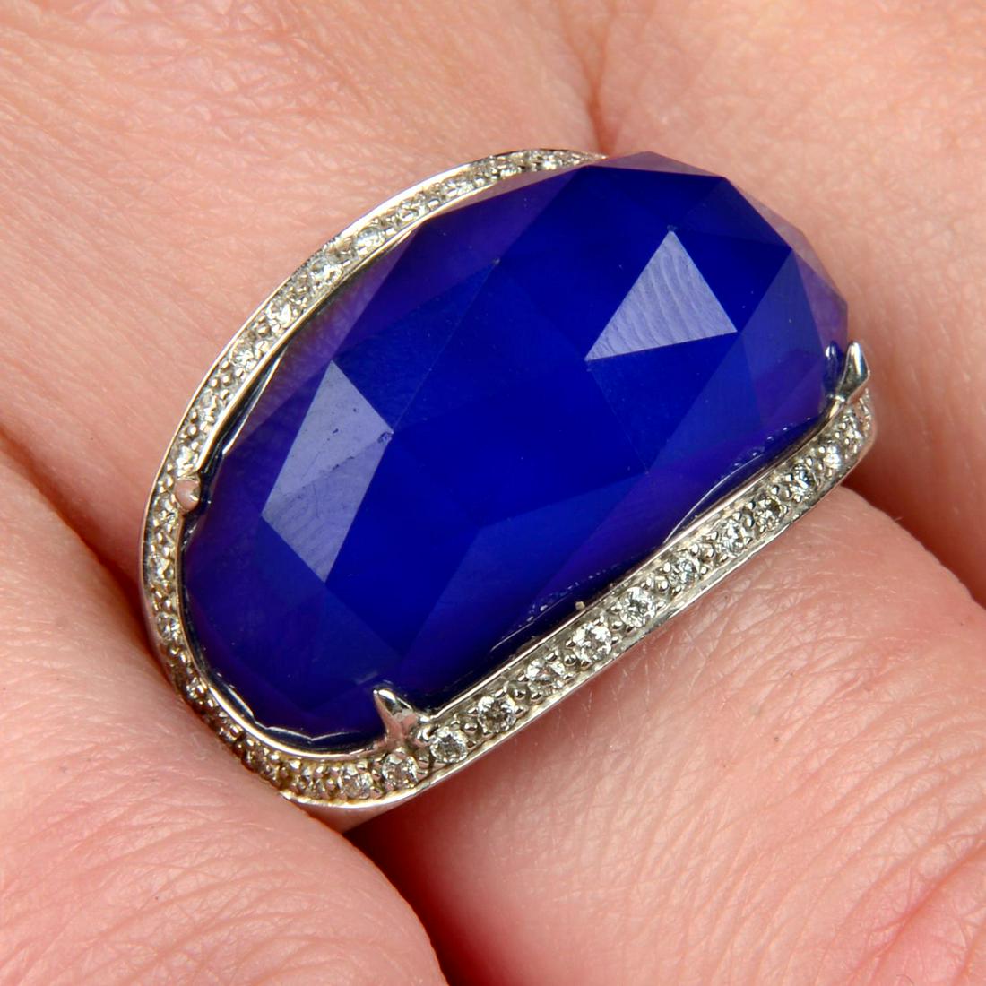 An 18ct gold brilliant-cut diamond and blue 'Crystal Haze' ring, by Stephen Webster.Estimated total: An 18ct gold brilliant-cut diamond and blue 'Crystal Haze' ring, by Stephen Webster.Estimated total diamond weight 0.25ct.Hallmarks for London, 2013. Ring size N. 13gms.