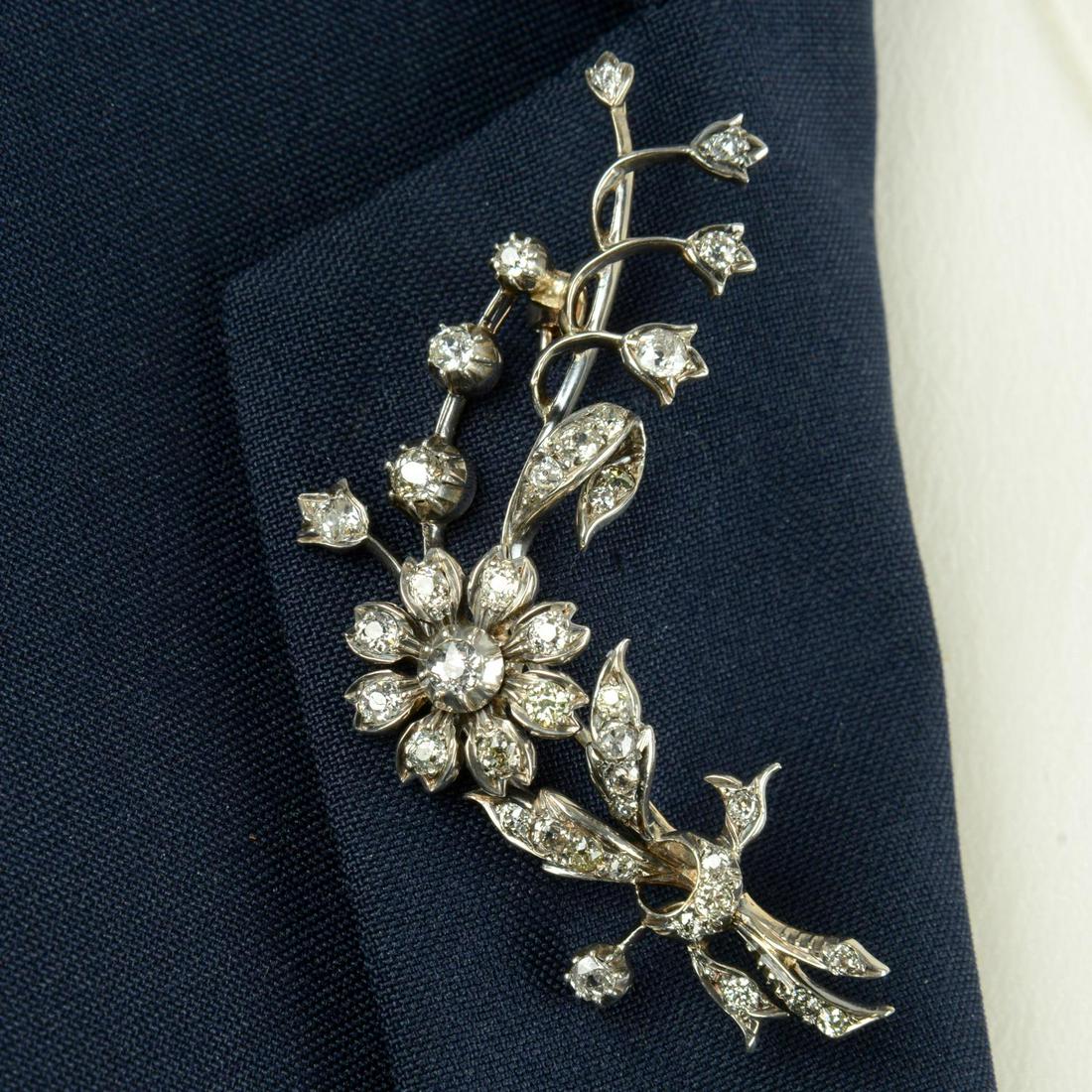 A late 19th century silver and gold old-cut diamond floral brooch.Estimated total diamond weight (1 of 4)