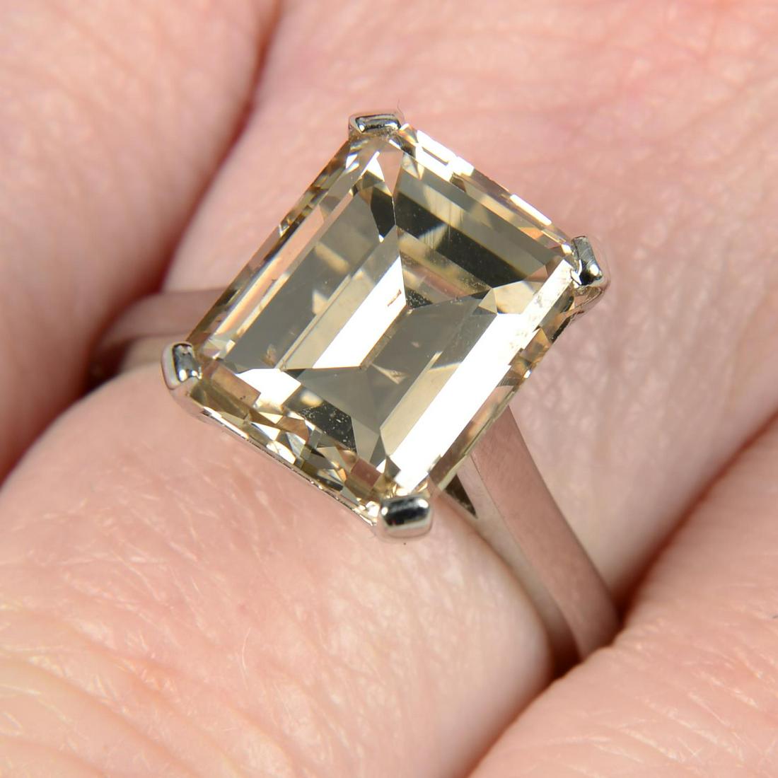 An 18ct gold rectangular-shape diamond single-stone ring.Diamond weight 5.76cts, estimated tinted (1 of 5)